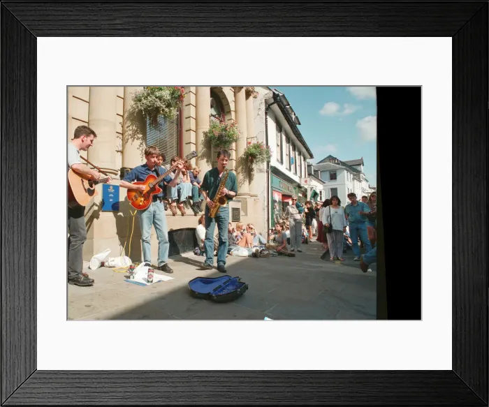 Framed Print : The Brecon Jazz Festival. Brecon, South Wales, A small musical group perform Framed Print : The Brecon Jazz Festival. Brecon, South Wales, A small musical group perform