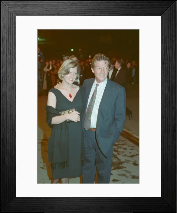 Framed Print : John Hurt and his partner Jo Dalton arrive at The Odeon Leicester Square Framed Print : John Hurt and his partner Jo Dalton arrive at The Odeon Leicester Square