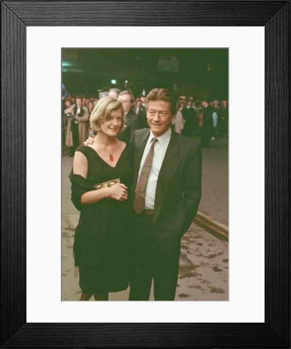 Framed Print : John Hurt and his partner Jo Dalton arrive at The Odeon Leicester Square Framed Print : John Hurt and his partner Jo Dalton arrive at The Odeon Leicester Square