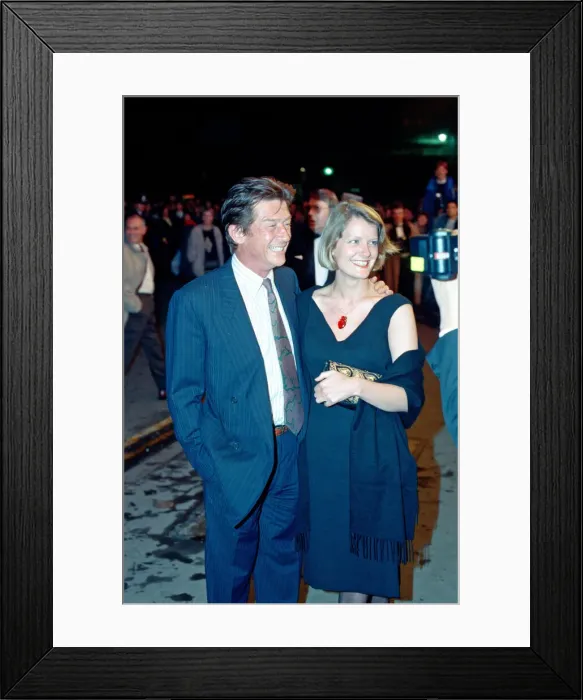 Framed Print : John Hurt and his partner Jo Dalton arrive at The Odeon Leicester Square Framed Print : John Hurt and his partner Jo Dalton arrive at The Odeon Leicester Square