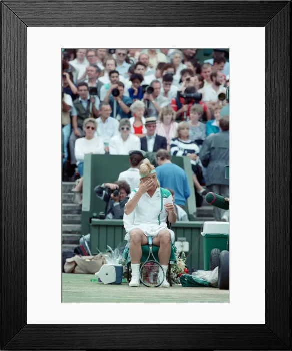Framed Print : Martina Navratilova seated during a break at the Wimbledon final against Steffi Graf Framed Print : Martina Navratilova seated during a break at the Wimbledon final against Steffi Graf