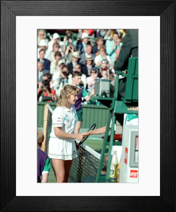 Framed Print : Steffi Graf pictured at the net shaking the hand of Martina Navratilova who she has just Framed Print : Steffi Graf pictured at the net shaking the hand of Martina Navratilova who she has just