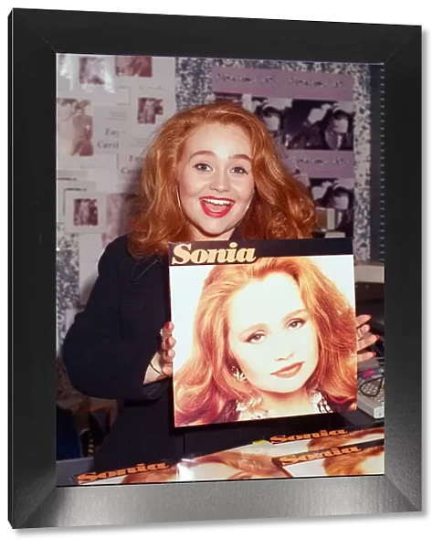 Pop star Sonia signing copies of her album Sonia in Reading. 8th October 1991