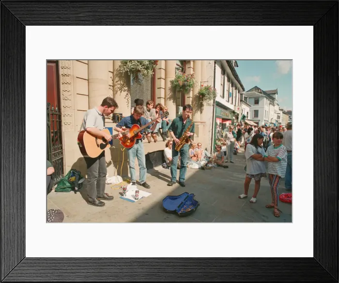Framed Print : The Brecon Jazz Festival. Brecon, South Wales, A small musical group perform Framed Print : The Brecon Jazz Festival. Brecon, South Wales, A small musical group perform