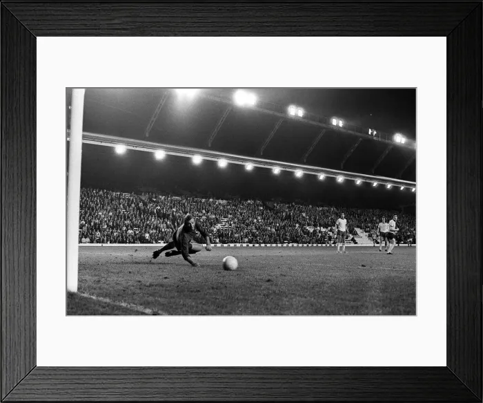 Framed Print : Brian Kidd scores for Manchester United past Bob Wilson of Arsenal at Anfield Framed Print : Brian Kidd scores for Manchester United past Bob Wilson of Arsenal at Anfield