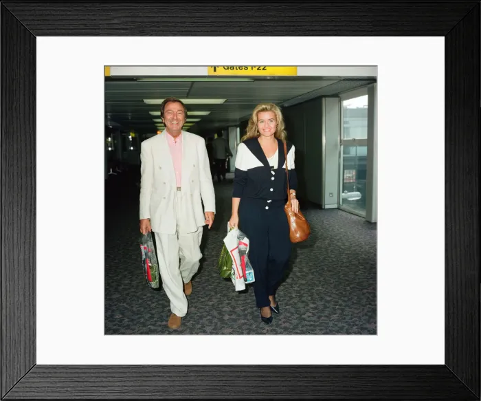 Framed Print : Des O Connor and girlfriend Jodie Brooke Wilson and Heathrow Airport Framed Print : Des O Connor and girlfriend Jodie Brooke Wilson and Heathrow Airport