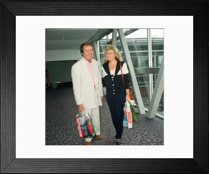 Framed Print : Des O Connor and girlfriend Jodie Brooke Wilson and Heathrow Airport Framed Print : Des O Connor and girlfriend Jodie Brooke Wilson and Heathrow Airport