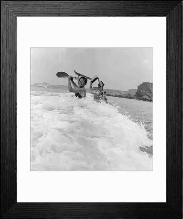 Framed Print : When the foaming waves break with a roar, bathers throw themselves forward onto their Framed Print : When the foaming waves break with a roar, bathers throw themselves forward onto their