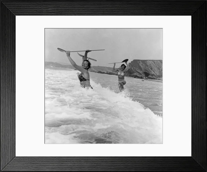 Framed Print : When the foaming waves break with a roar, bathers throw themselves forward onto their Framed Print : When the foaming waves break with a roar, bathers throw themselves forward onto their