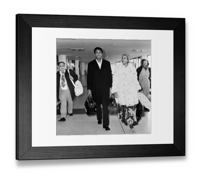 Framed Print : Boxer Muhammad Ali and wife Belinda at Heathrow Airport en route to Beruit from New York