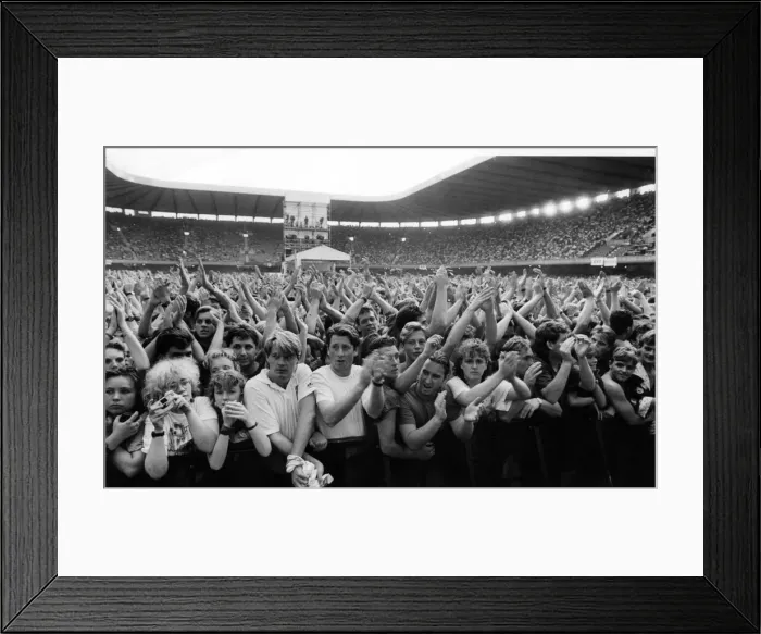Framed Print : The crowd enjoy rock group Simple Minds in concert at The National Stadium