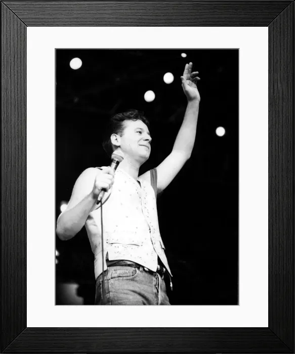 Framed Print : Jim Kerr, lead singer of the rock group Simple Minds entertains the crowd at the groups Framed Print : Jim Kerr, lead singer of the rock group Simple Minds entertains the crowd at the groups