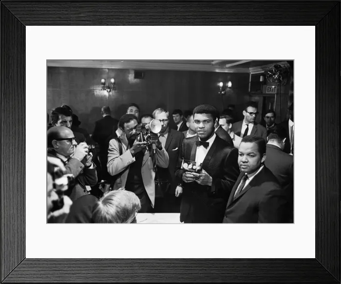 Framed Print : Cassius Clay holds a case with 24 carrot gold coins in memory of Sir Winston Churchill