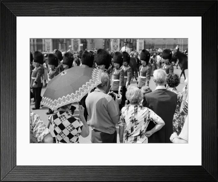 Framed Print : Changing of the Guard in London today. An umbrella serves as a sun-shade for a spectator Framed Print : Changing of the Guard in London today. An umbrella serves as a sun-shade for a spectator