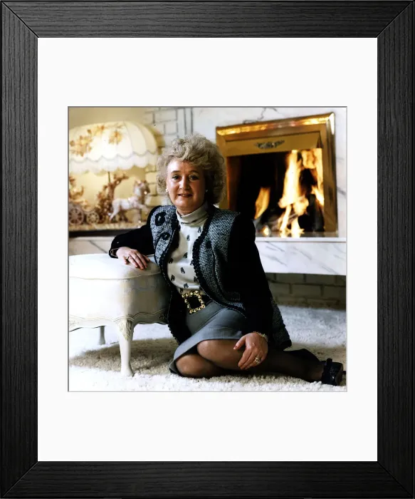 Framed Print : Vera Weisfeld sitting on white fire side rug leaning on foot stool grey Framed Print : Vera Weisfeld sitting on white fire side rug leaning on foot stool grey