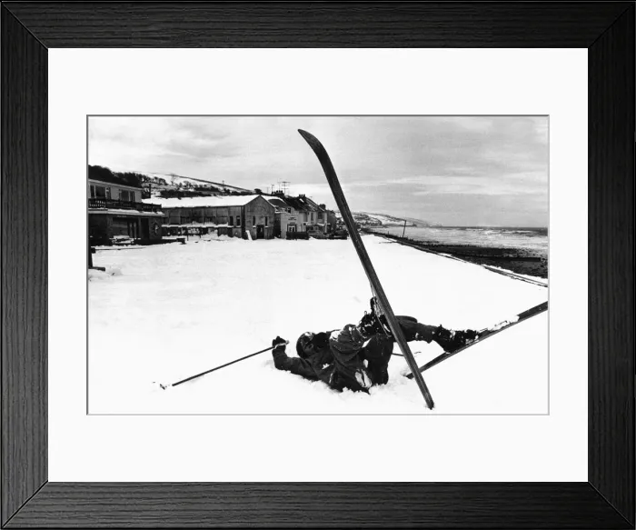 Framed Print : Skier takes a tumble on the beach at Amroth, Pembrokeshire, West Wales Framed Print : Skier takes a tumble on the beach at Amroth, Pembrokeshire, West Wales