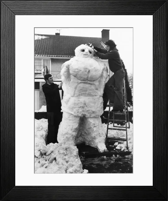 Framed Print : Two young men build a giant snowman, Wales, 22nd February 1978 Framed Print : Two young men build a giant snowman, Wales, 22nd February 1978