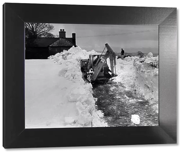 Digger tries to clear a way through, on the road from Pentre Meyrick, to Llantwit Major
