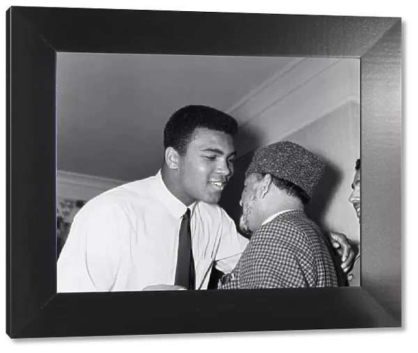 Muhammad Ali (Cassius Clay) greeting muslims at a public speaking about Islam