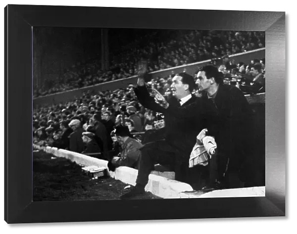 Scotland football manager Jock Stein and Walter McCrae cheer on their team after Scotland