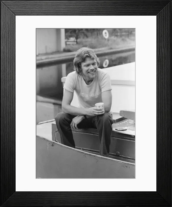 Framed Print : Richard Branson, 28 year old mastermind behind Virgin Music company. Relaxing on his boat Framed Print : Richard Branson, 28 year old mastermind behind Virgin Music company. Relaxing on his boat