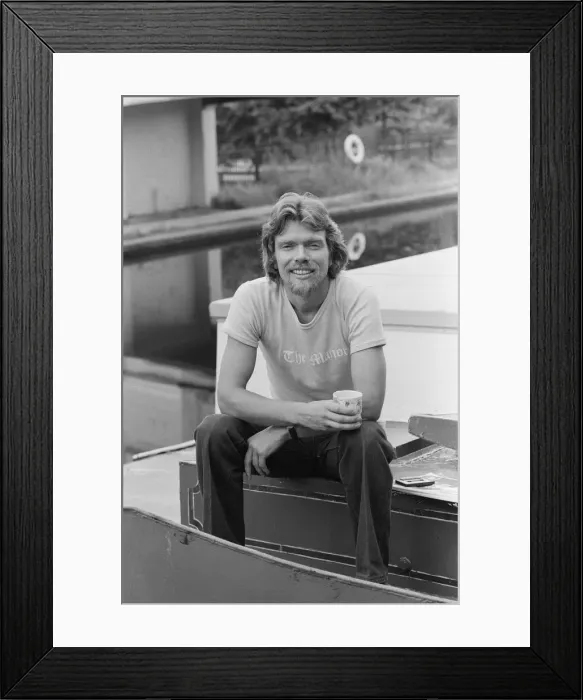 Framed Print : Richard Branson, 28 year old mastermind behind Virgin Music company. Relaxing on his boat