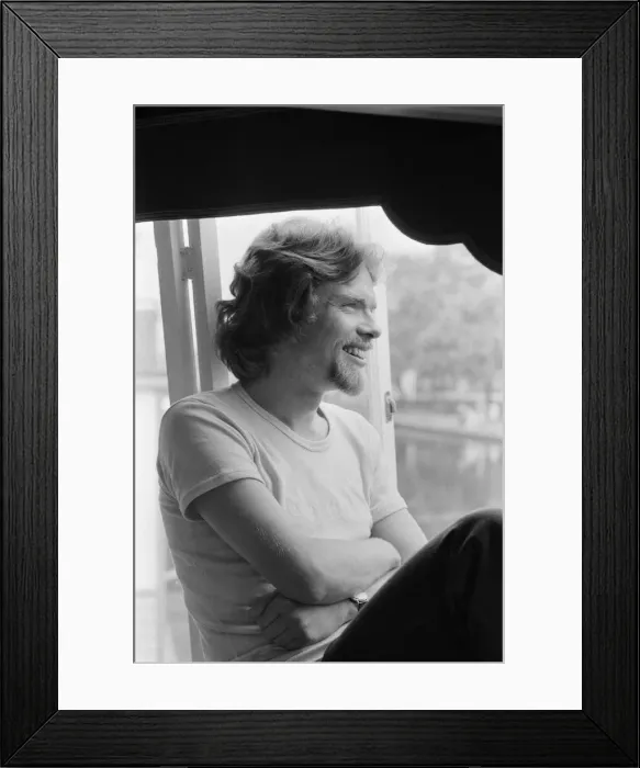 Framed Print : Richard Branson, 28 year old mastermind behind Virgin Music company. Relaxing on his boat