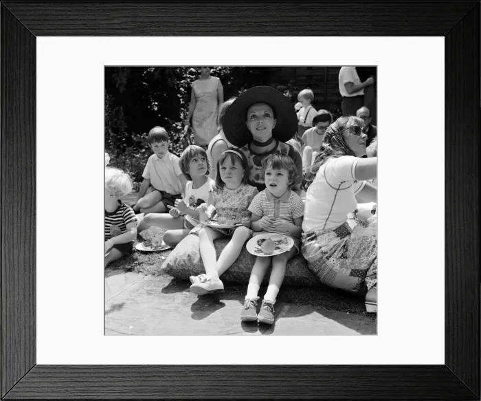 Framed Print : Actor Michael Crawford holds a barbeque in the garden of his home in Wimbledon
