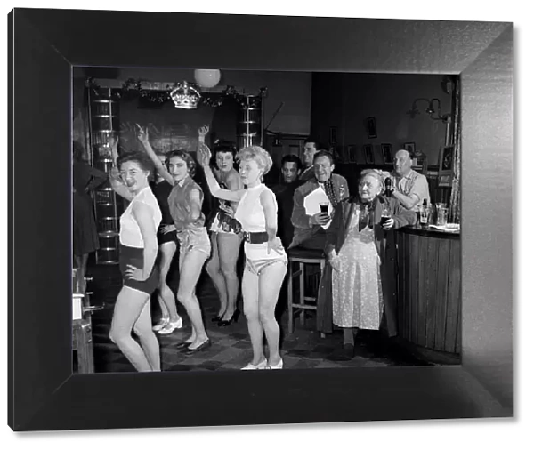 Chorus girls rehearse in the bar of The Jolly Tanners pub. 27th March 1954