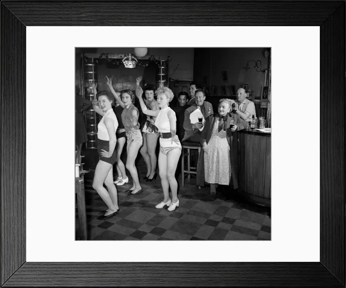 Framed Print : Chorus girls rehearse in the bar of The Jolly Tanners pub. 27th March 1954