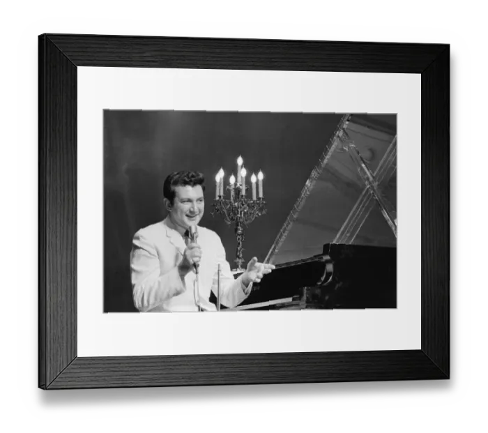 Framed Print : Liberace entertains the audience at The Royal Variety Show held in the presence of her