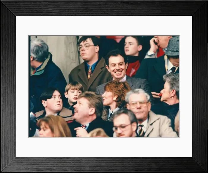 Framed Print : Tony Blair (smiling, above the red haired lady) in the crowd at Anfield