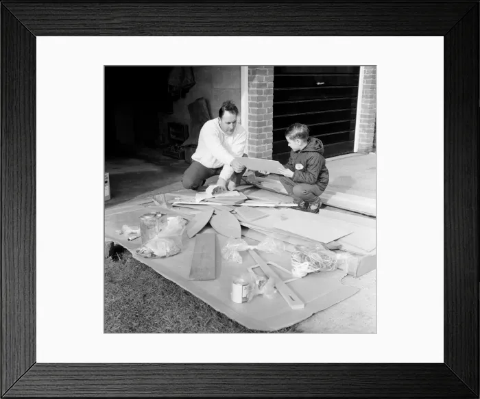 Framed Print : Mr Larry Cooper has just received a kit of parts to build a Mirror'dinghy