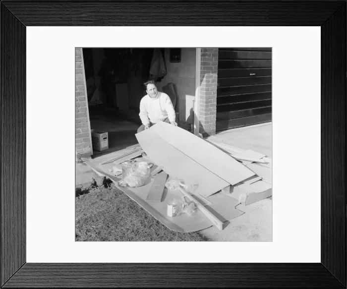 Framed Print : Mr Larry Cooper has just received a kit of parts to build a Mirror'dinghy
