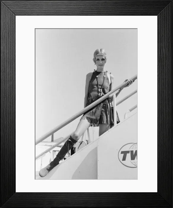 Framed Print : Twiggy, (real name Leslie Hornby) English model, seen in a Hippie gear outfit leaving Framed Print : Twiggy, (real name Leslie Hornby) English model, seen in a Hippie gear outfit leaving