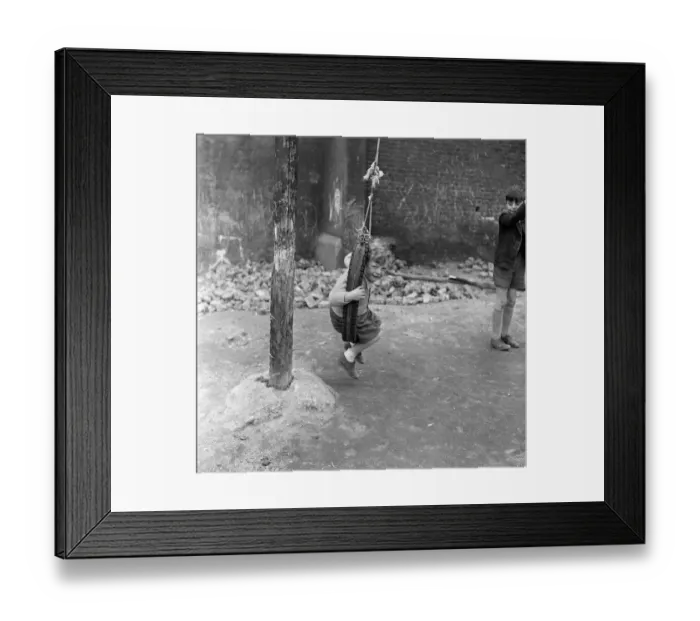 Framed Print : Boys playing at Clydesdale Road adventure playground. 18th May 1955