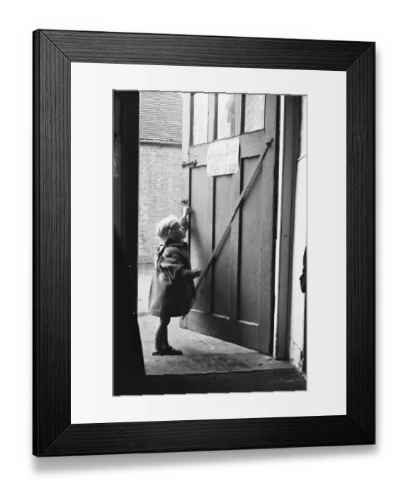 Framed Print : Child closing the door to the classroom following morning break at Roxeth Primary School Framed Print : Child closing the door to the classroom following morning break at Roxeth Primary School