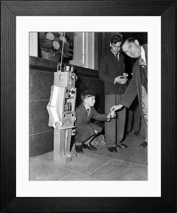Framed Print : A young boy with a robot guy. 8th October 1957 Framed Print : A young boy with a robot guy. 8th October 1957