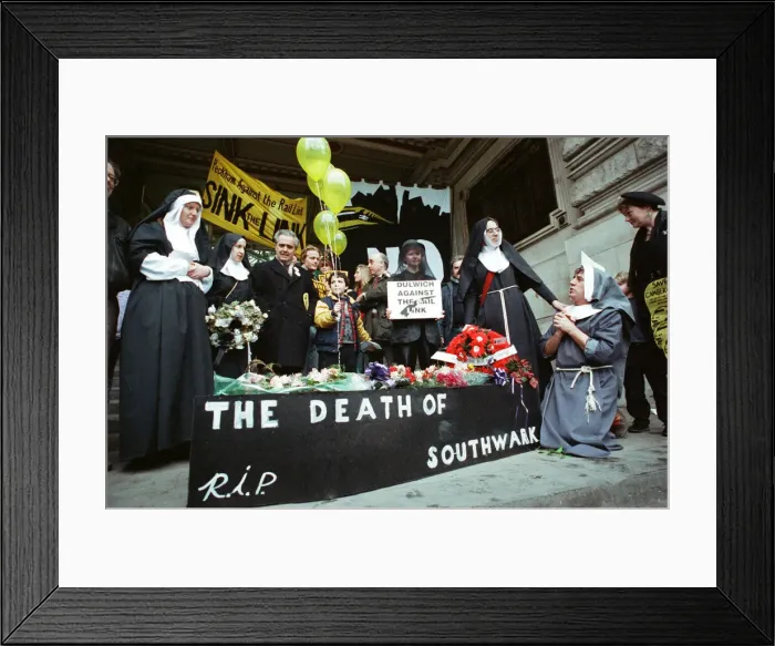 Framed Print : Comedian and actor Terry Jones takes part in a rail tunnel protest outside Waterloo
