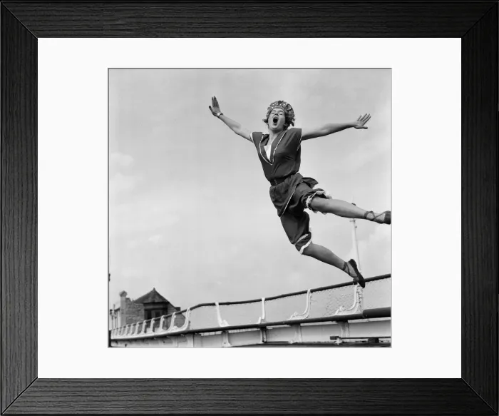 Framed Print : Jean Richardson, aged 23 from Bath, wears a 1890 bathing costume as she leaps high in Framed Print : Jean Richardson, aged 23 from Bath, wears a 1890 bathing costume as she leaps high in
