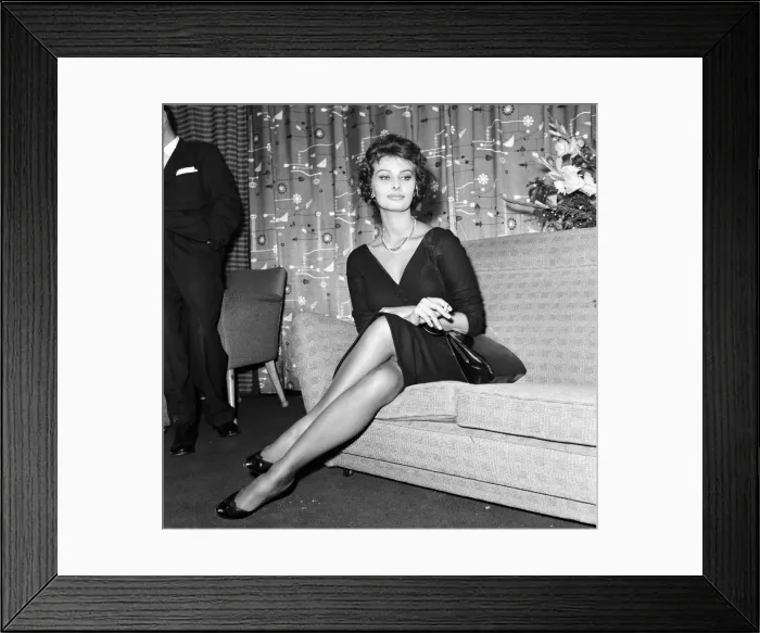Framed Print : Sophia Loren pictured sitting in a chair at London Airport