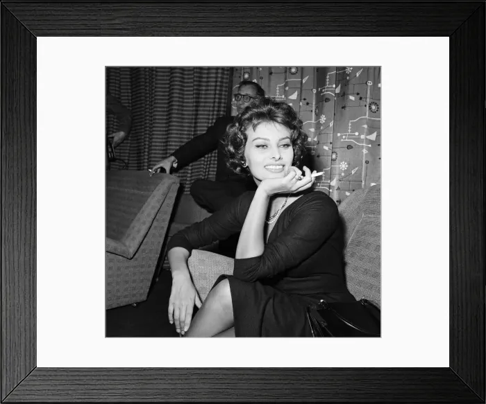 Framed Print : Sophia Loren pictured sitting in a chair at London Airport Framed Print : Sophia Loren pictured sitting in a chair at London Airport