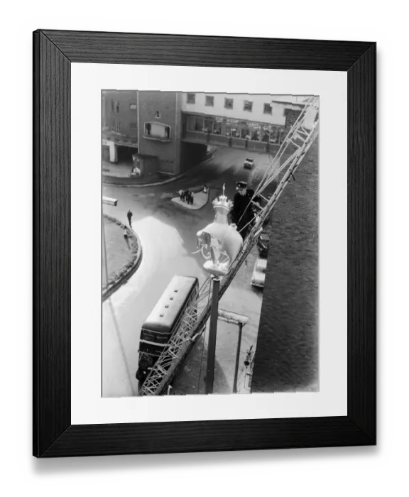 Framed Print : Fireman helps place the Elephant and Castle statue on top of the standard in Broadgate Framed Print : Fireman helps place the Elephant and Castle statue on top of the standard in Broadgate