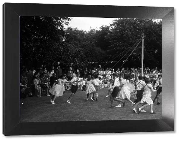 Children dancing around the May Pole in a Coventry Suburb circa 1960