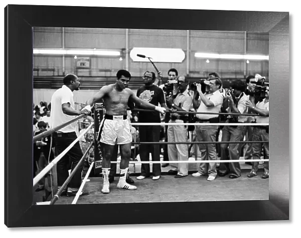 Muhammad Ali mobbed by reporters in his training camp ahead of his upcoming fight against