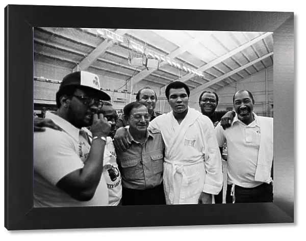 Muhammad Ali (centre) in his training camp with his team for his upcoming fight with