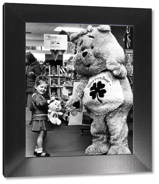 Melissa, aged three, meets the Good Luck Bear during celebrations at Rackhams