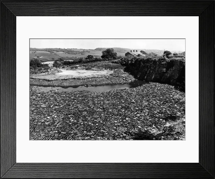 Framed Print : Hundreds of old beer crates float in the disused quarry pond near Wenvoe