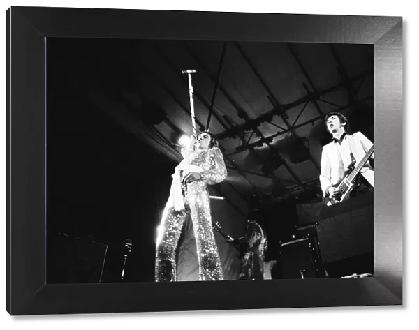 Rod Stewart (left) and bass player Ronnie Lane with Ronnie wood in the background
