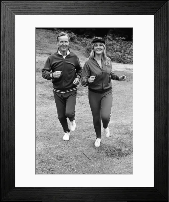 Framed Print : Television personality Nicholas Parsons jogging with his daughter. September 1976 Framed Print : Television personality Nicholas Parsons jogging with his daughter. September 1976